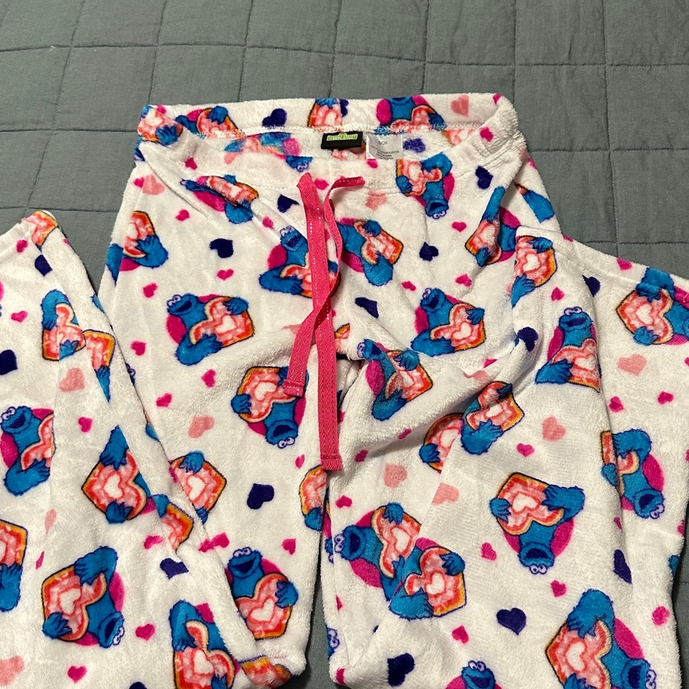 Sesame Street White Pajama Pants with Colorful  Cookie Monster holding a heart.